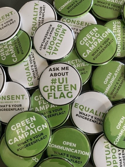 Many small Green Flag campaign buttons