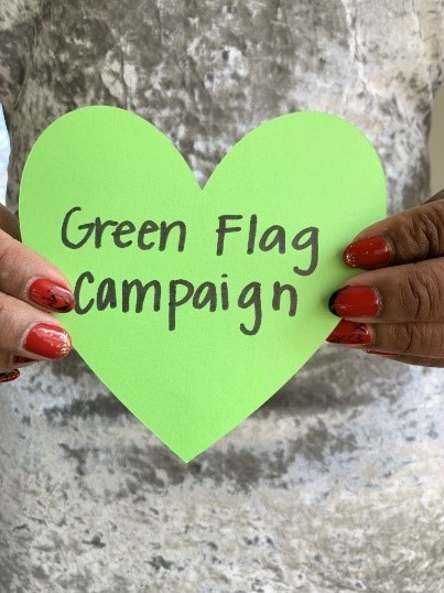 Paper cutout of a heart that has "Green Flag Campaign" written on it